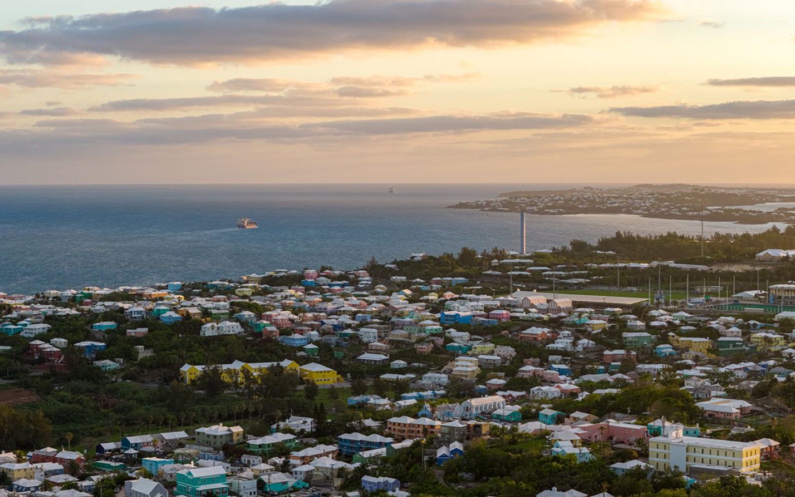 A Bermuda coastal town at golden hour.