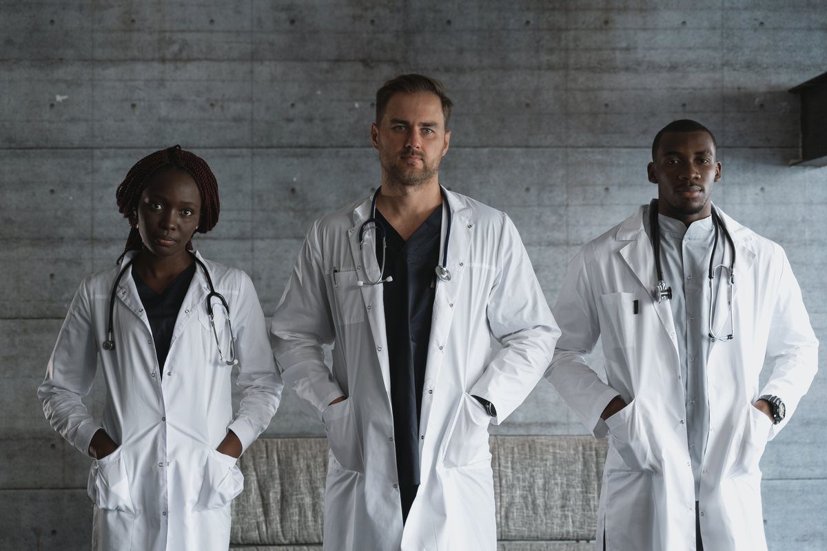 Three confident doctors standing together